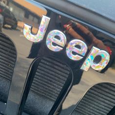 the letters jeep are made out of holographic stickers