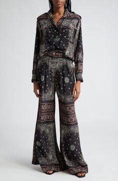 Covered with a bandana print incorporating the label's name, these silk-enriched belted pants push the swish factor off the charts with billowy, extrawide legs. 34 1/2" inseam; 46" leg opening; 13" front rise; 17" back rise (size 2US) Zip fly with hook-and-bar closure Front slant pockets Removable belt 70% viscose, 30% silk Dry clean Imported Designer Clothing Pleated Wide Leg Pants, Black Bandana, Utility Pockets, Belted Pants, Bandana Print, Pullover Shirt, Stand Collar, Leg Pants, Black Pants