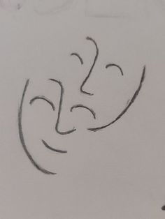 a drawing of a face drawn on paper