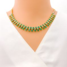 This exquisite 18k yellow gold necklace set, weighing 41.8 grams, features a luxurious design adorned with dazzling diamonds and vibrant emeralds. The yellow gold finish enhances its elegant appeal, making it perfect for any special occasion. The set includes a necklace with a total diamond weight of 2.95 carats, featuring F-G color and VS quality diamonds. The necklace has a length of 15 inches with adjustable 1.1-inch links and is secured with a hook lock. The matching earrings, each measuring Gold Plated Emerald Necklace For Formal Events, Formal Gold Plated Emerald Necklace, Formal Gold-plated Emerald Necklace, Elegant Hand-set Emerald Necklace In Yellow Gold, Elegant Yellow Gold Hand Set Emerald Necklace, Emerald Necklace With 17 Jewels For Celebration, Green 22k Gold Jewelry Set For Wedding, Green 22k Gold Wedding Jewelry Set, Festive Yellow Gold Emerald Necklace With Gemstone