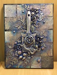 an artistic metal artwork on a wooden surface