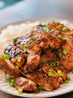 a white plate topped with chicken and rice