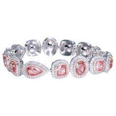 This exquisite ladies bracelet features a stunning array of natural diamonds, perfectly complemented by sparkling round white diamonds. The diamonds are of F-G color and VS+ clarity, ensuring exceptional brilliance and quality. The bracelet is meticulously crafted in 18k white gold to highlight the beauty and unique allure of each stone. Details: Center Stone: 16.58ct (15 pieces) of fancy diamonds Round White Diamonds: 3.84ct (696 pieces), F-G color, VS+ clarity Total Weight: 30.50g Metal: 18k w Luxury Pink Diamond Bracelets, Colored Diamond Jewelry, Ladies Bracelet, Bracelet Tennis, Pink Diamonds, Gold Armband, Gold Bracelet For Women, Fancy Diamonds, Rare Gems