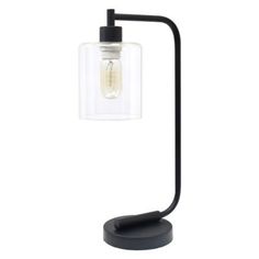 a black table lamp with a clear glass shade