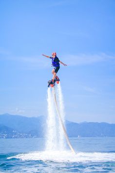 a man on water skis jumping in the air