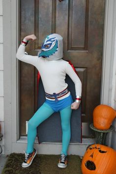 a person in costume standing by a door