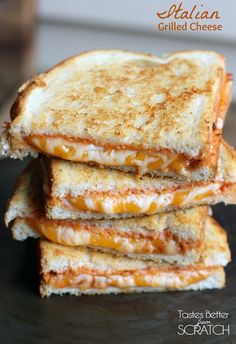 three grilled cheese sandwiches stacked on top of each other