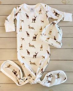 One of our sweetest patterns is now available for your sweet little one. The newborn gown and matching hat will be the perfect addition to your hospital bag.  DETAILS: size: newborn material: 100% cotton jersey (stretchy) two fabric flaps allow for the outfit to form a knot on the bottom Newborn Gown, Bag Details, Deer Print, Matching Hat, Newborn Outfit, Hospital Bag, Bag Shop, Outfits With Hats, Adorable Baby