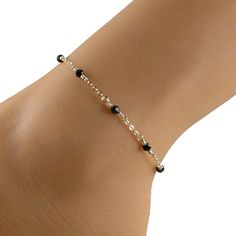 This elegant black crystal anklet features black Swarovski crystals and 14k gold filled chain and fastens with a 14k gold filled lobster clasp. An ideal companion to that little black dress! Please choose the size that you need from the drop-down menu, bearing in mind that the anklet should be approximately one inch larger than the size of your ankle. The anklet will arrive in an attractive gift box. Black Beaded Anklets, Cheap Adjustable Black Beaded Anklets, Affordable Adjustable Black Beaded Anklets, Cheap Black Festival Anklets, Elegant Black Beaded Anklets, Gold Chain Anklet, Black Anklet, Elegant Anklet, Delicate Gold Jewelry