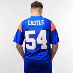 Combine your love of sports, streetwear and nostalgia by copping the Thad Castle Blue Mountain State Football Jersey. This bold jersey features contrast panelling and striping all throughout and embroidered team logos on the sleeves and front and centre. Don't sleep on this iconic hockey jersey, available now at Jersey Nation while stock lasts! - Thad Castle Blue Mountain State Football Jersey- Fully embroidered graphics: Team, Name, Number detailing, logo- Premium tackle twill stitching- Anti p Blue Jersey With Team Logo For Game Day, Blue Baseball Jersey With Team Logo For Sports, Blue Baseball Jersey For Sports Season Fan Gear, College Blue Jersey With Team Logo, Varsity Blue Top For Team Events, Sporty Blue Jersey With Team Logo, Varsity Blue Tops For Team Events, Blue Varsity Tops For Team Events, Sporty College Jersey For Football Season