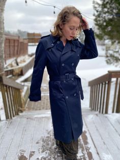 Vintage Navy Blue Classic Trench Coat by Pierre Cardin. Size is 38 T (Tall) Lovely designer trench coat, made well and has the original belt. Longer in the arms and length slightly. Fantastic vintage condition. Measured flat and in inches. Pit to pit - 20 in Waist - 20 in Hips - 22 in Sleeve - 26 in Length shoulder to hem - 46 in Winter Workwear Raincoat, Single-breasted, Winter Workwear Raincoat Single Breasted, Winter Single-breasted Raincoat For Work, Classic Long Sleeve Raincoat For Work, Classic Long Sleeve Raincoat, Classic Winter Raincoat For Work, Winter Workwear Raincoat With Button Closure, Fitted Winter Workwear Raincoat, Fitted Raincoat For Winter Workwear