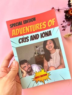 a person holding up a book about the adventures of cris and iona on a pink background