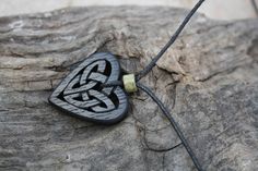 "This beautiful and unique hand-carved Celtic heart pendant will be made for you, or a loved one, in my studio on the West of Ireland. Bog Oak comes from ancient forests that once covered Ireland. Huge oaks have been buried in peat bogs and preserved from decay by the acidic and anaerobic bog conditions, sometimes for hundreds or even thousands of years. The wood is usually stained black by tannin dissolved in the acidic water. Bog-wood represents the early stages in the fossilization of wood, w Carved Heart Shaped Jewelry Gift, Carved Heart-shaped Jewelry For Gift, Carved Heart Jewelry Gift, Heart-shaped Carved Jewelry Gift, Heart Shaped Carved Jewelry Gift, Irish Love, Peat Bog, Celtic Heart, Old Irish