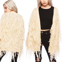 The One Of A Kind Cardigan Is Accessorized With Beautiful Fringe Throughout The Jacket That Gives It A Shaggy Faux Fur Look. This Open Jacket Has Long Sleeves,A Top Hook Closure And A Straight Hemline. If You Like The Brands: {Loft, J. Crew, Anthropologie, Madewell, Forever 21, Urban Outfitters, Free People, Xhilaration, Dolls Kill, Asos, Zara, Nasty Gal, Aeo, Hollister, Brandy Melville, American Apparel, Unif, Lazy Oaf, Oh-Mighty, Talbots, Coldwater Creek, Lulu's} Spring Cream Fringe Outerwear, Spring Long Sleeve Fringe Cardigan, Chic Fringe Cardigan, Knit Long Sleeve Outerwear With Fringe, Brown Long-sleeve Fringe Outerwear, Lazy Oaf, Boho Fringe, Coldwater Creek, Dolls Kill