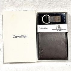 Nwt Calvin Klein Brown Genuine Leather Passcase Wallet Silver Ley Fob Box Gift Set Modern Brown Wallet With Interior Key Chain Holder, Rectangular Business Wallet With Interior Key Chain Holder, Minimalist Card Wallet, Calvin Klein Wallet, Calvin Klein Bags, Minimalist Cards, Calvin Klein Bag, Leather Card Case, Genuine Leather Wallets