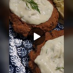 some food is sitting on a blue and white cloth with a green sprig