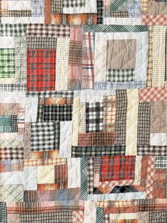 a patchwork quilt with many different colors and patterns