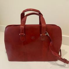 **New** Never Used Comes With Duster Bag 17” X 14” Leather Designer Red Business Bag, Red Business Bag With Adjustable Strap, Classic Red Rectangular Bag, Red Satchel Briefcase With Top Carry Handle, Red Rectangular Laptop Bag For Everyday, Red Rectangular Laptop Bag, Red Rectangular Briefcase, Red Leather Travel Briefcase, Classic Red Shoulder Bag For Travel