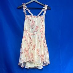 Great Condition. New With Tags. Size Small. Shorts Under Dress. Crosses In Back. Pink Sleeveless Floral Dress For Casual Occasions, Pink Sleeveless Floral Dress For Brunch, Pink Sundress For Party With Floral Design, Pink Flowy Lined Sundress, Summer Pink Floral Dress For Casual Wear, Pink Floral Dress For Casual Summer Wear, Pink Floral Dress With Spaghetti Straps For Brunch, Flowy Lined Pink Dress, Pink Knee-length Sundress For Spring