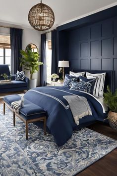 a bedroom with blue walls and furniture