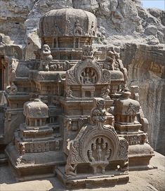 an intricately carved stone structure in the desert