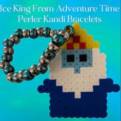 a piece of art made out of legos and beads with the words ice king from adventure time perler kandi bracelets