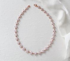 This delicate rose gold cubic zirconia bridal necklace was made to make your wedding day shine a little brighter! - Crafted with Swarovski Pure Brilliance cubic zirconia stones- Necklace measures 16 inches and extends to 18 inches with an extension chain. (extension chain not pictured in photos)- Available in rose gold Delicate Wedding Necklace, Gold Bridal Jewelry, Rose Gold Bridal Jewelry, Wedding Earrings Chandelier, Dainty Wedding, Gold Bridal Necklace, Bridal Earrings Chandelier, Backdrops Necklace, Wedding Necklaces