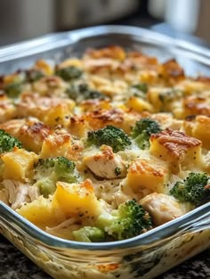 a casserole dish with chicken and broccoli in it on a table