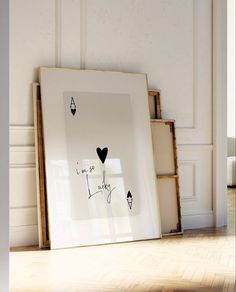 a white frame with some black hearts on it