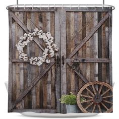 an old barn door with a wreath and wheel on it shower curtain set size 70 h x 69 w