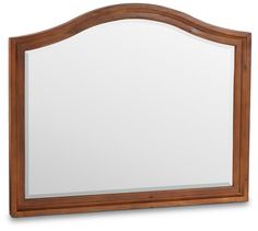 a wooden framed mirror on a white background