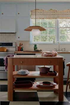 a kitchen island with plates and bowls on it