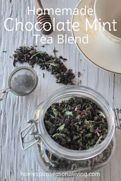 homemade chocolate mint tea blend in a glass jar next to a cup and saucer