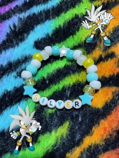 if anyone wants to suggest a character I should make into a bracelet or any jewelry of your choice, feel free to comment! #silverthehedgehog #silver #sonic #sonicthehedgehog #kandi #bracelet Sonic Diy Crafts, Character Bracelet Ideas, Sonic Bracelet Pattern, Kandi Accessories, Sonic Bracelet, Sonic Kandi, Kandi Aesthetic, Crafts To Do When Your Bored, Pony Bead Bracelets