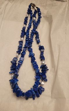 Beautiful blue lapis lazuli and seed pearl necklace. Double Strand Excellent condition. Measures 9 inches long. Blue Double Strand Beaded Necklace With Natural Stones, Blue Double Strand Natural Stones Jewelry, Single Strand Lapis Lazuli Beaded Necklace As Gift, Blue Double Strand Pearl Necklace Gift, Blue Double Strand Pearl Necklace For Gift, Blue Double Strand Beaded Pearl Necklace, Blue Lapis Lazuli Pearl Necklace Gift, Single Strand Lapis Lazuli Bead Necklace, Blue Multi-strand Gemstone Necklaces