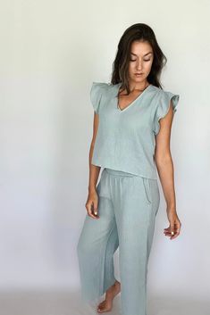 For the babes living in sun... Stay comfortable in style with these Double Gauze Smocking Waist Pants. The perfect pick for relaxed easy days. Crafted from lightweight cotton, with a smocking waist for a comfortable fit. Discover your favorite new look in these feminine and fashionable pants! Product Details: ❥ Color: Sea Blue ❥ Gauze pants for women ❥ Smocking high waist detail ❥ Side pockets ❥ Lightweight / breathable material❥ Make sure to check out the matching Gauze Ruffled Sleeve Top for Gauze Pants, Lounge Looks, Gauze Top, Easy Day, Pants Large, Ruffled Sleeve Top, Double Gauze, Ruffled Sleeves, Sea Blue