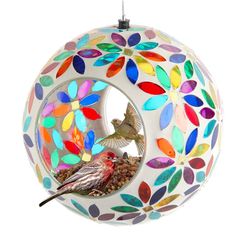 a colorful bird feeder hanging from the ceiling