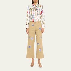 Libertine "Cecil Beaton" pants with crystal-embellished blue carnations Approx. 25" inseam Cropped fit Mid rise sits high on hip Wide legs Five-pocket style Button/zip fly; belt loops Cotton/elastane Dry clean Made in USA Floral Embroidered Pants For Spring Workwear, Floral Embroidered Straight Pants For Workwear, Floral Embroidery Straight Pants For Workwear, Floral Embroidery Straight Pants For Work, Floral Embroidered Bottoms For Workwear In Spring, Spring Floral Embroidered Bottoms For Work, Floral Embroidered Bottoms For Spring Workwear, Art Deco Letters, Blue Carnations