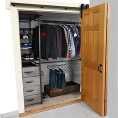 an open closet with clothes and shoes in it