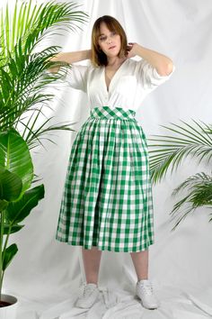 Green check high waist full gathered skirt. Perfect for casual outfits and special ocasions with pair of trainters or high heels. 100% cotton.  Elastic at the back of waist.  Two side pockets. Midi lenght about 70cm + 5 cm waistband. Handmade in UK.  Model wears size S.  HOW TO CHOOSE A SIZE ?   Using a measuring tape, measure the smallest part of your waist.  SIZE CHART: (CM) XS - W: 66 CM S - W: 70 CM M - W: 74 CM  L - W: 78 CM  XL - W: 82 CM  CARE INSTRUCTIONS: Hand wash only, do not bleach, Summer Plaid Pleated Skirt, Classic Midi-length Bottoms For Summer, Summer Cotton Pleated Skirt For Daywear, Cotton Summer Pleated Skirt For Daywear, Summer Daywear Cotton Pleated Skirt, Classic Cotton Midi Skirt, Classic Midi Length Cotton Skirt, Classic Cotton Pleated Skirt For Spring, Fitted Cotton Skirt For Picnic