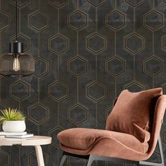 a chair and table in front of a wall with hexagon tiles on it