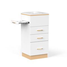 a white cabinet with three drawers and a gold handle on the bottom one drawer is open