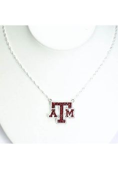 Add some Texas A&M gear to your jewelry collection with this Texas A&M Aggies Bling Necklace! It features a silver chain with jeweled team logo, so everyone will know how much you love your Aggies! Team logo designed in team color crystals, 17" silver plated chain with 2" extender, Makes a great gift for the sports fan in your life!, Perfect for game day!, Sruface washable, Imported Aggie Mom Mug, Gig Em Aggies, M Jewelry, Logo Necklace, M Necklace, Texas Aggies, Crystal Logo, Bling Necklace, Silver Jewelry Design