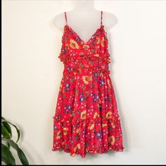 Absolutely Gorgeous Red Floral Dress.. With Ruffled Detail And Zippered Back.. I'm So Upset It Doesn't Fit. I Should Have Gotten Better Measurements So Here They Are. 14" At The Underbust 30" From Top Of Bust To Hem. 100% Polyester... Zero Stretch. Flirty Red Floral Print Dress, Flirty Red Sundress For The Beach, Flirty Red Sundress For Beach, Red Flirty Sundress For Vacation, Red Flirty Dress For Vacation, Red Floral Print Sleeveless Sundress, Red Floral Print Sundress For Day Out, Red Flowy Maxi Sundress, Red Floral Print Sundress