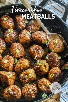 a skillet filled with meatballs and topped with scallions