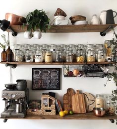 the shelves are filled with jars and other kitchen items