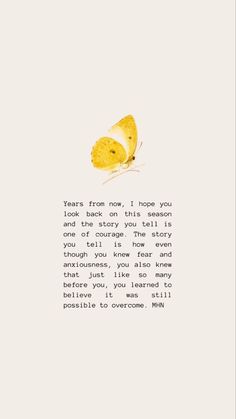 a yellow butterfly sitting on top of a piece of paper