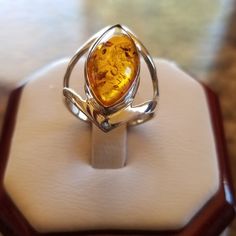 Gorgeous Honey Colored Natural Baltic Amber Ring! Stunning In Person! Set In 925 Stamped Sterling Silver. Brand New. Never Worn. Wholesale Prices Always....Or Less Can Be Resized If Needed By Any Professional Jewelry Repair Store! Amber Teardrop Sterling Silver Jewelry, Teardrop Cabochon Jewelry For Anniversary, Anniversary Teardrop Cabochon Jewelry, Silver Sterling Teardrop Rings, Silver Sterling Silver Teardrop Rings, Elegant Sterling Silver Amber Jewelry, Silver Teardrop Sterling Silver Rings, Amber Sterling Silver Jewelry For Anniversary, Formal Amber Sterling Silver Jewelry