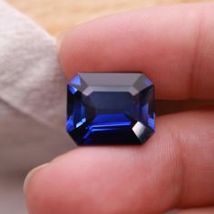 Lab Created Sapphire Measurements: 14.56 x 12.5 mm, 6.63 mm deep Weight: 11.98  carats  Cut: Emerald Cut Color: Medium Dark Blue  Clarity: Eye Clean  Condition: Great! This gem was recycled from old gold jewelry. Old Gold Jewelry, Cut And Color, Emerald Cut, Blue Sapphire, Loose Gemstones, Gold Jewelry, Emerald, Sapphire, Accessory Gift