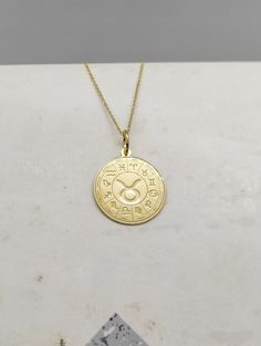 WE SHIP ALL PARCELS IN ONE BUSINESS DAY FOR FREE AND PROVIDE THE SPEEDIEST DELIVERY! Engraved Taurus Design Necklace - Astrology Pendant Necklace - Handmade Taurus Gold Jewelry - Engraved Taurus Gold Necklace Engraved Taurus Pendant Necklace made out of 14K Solid Gold. Available only in Yellow Gold finish. An elegant piece of jewelry that is a perfect gift to yourself and your loved ones. Charm Thickness: 0.5mm Jump Ring inner diameter: 4mm Add your engraved personalization at the back of the pe Yellow Gold Zodiac Sign Jewelry, Symbolic Yellow Gold Zodiac Jewelry, Symbolic Yellow Gold Jewelry With Zodiac Sign, Yellow Gold Zodiac Sign Amulet Necklace, Yellow Gold Zodiac Amulet Necklace, 14k Gold Zodiac Sign Necklace With Round Pendant, Yellow Gold Zodiac Sign Necklace For Anniversary, Anniversary Zodiac Sign Necklace In Yellow Gold, Anniversary Zodiac Sign Yellow Gold Necklace